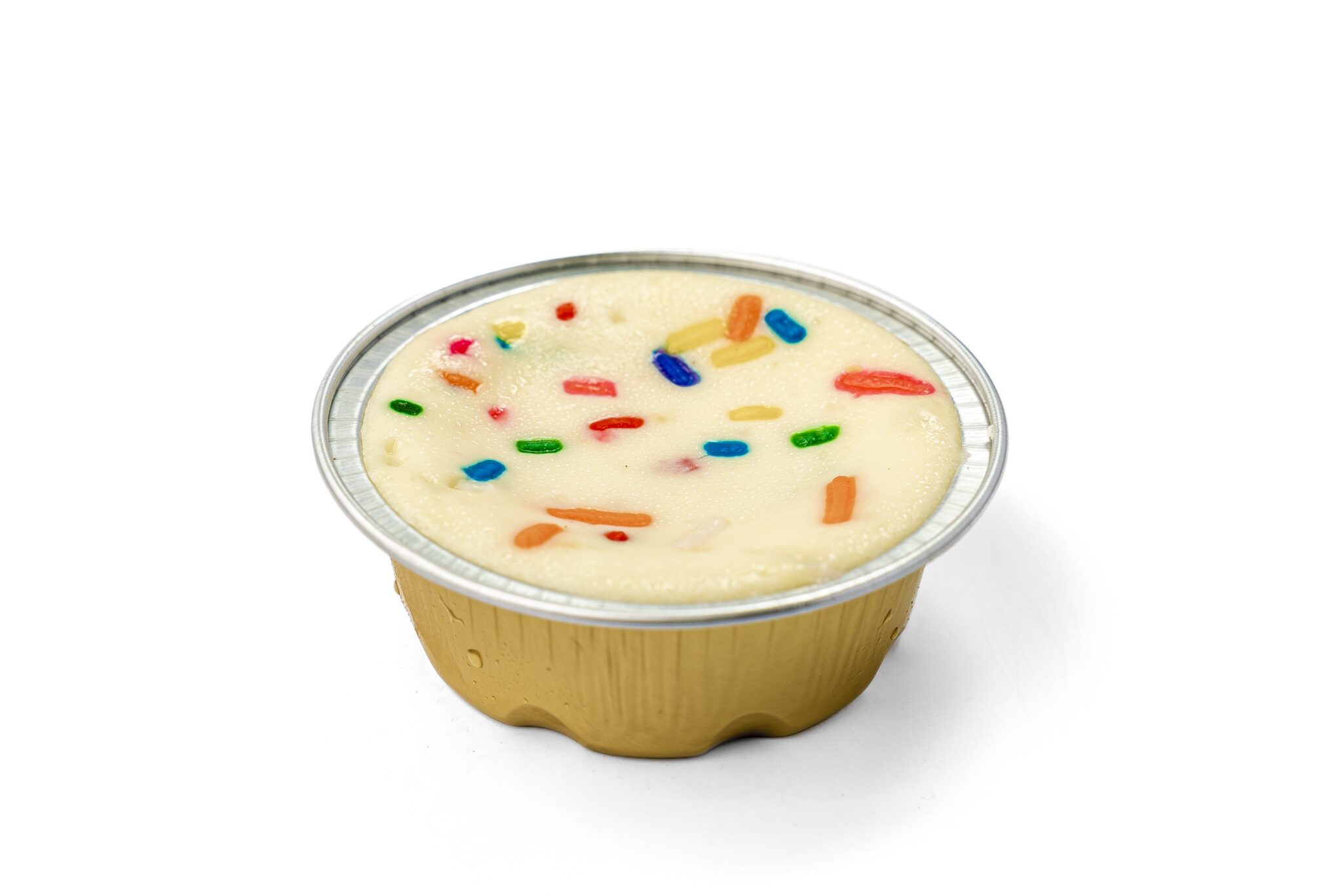 sprinkled mixed colored funfetti atop of mini cheesecake