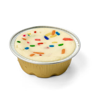 sprinkled mixed colored funfetti atop of mini cheesecake